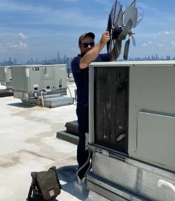 Technician working on a Commercial HVAC Unit
