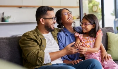 Woman Adjusting Thermostat
