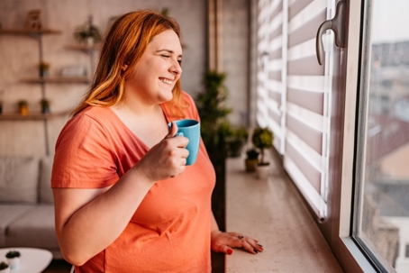 woman drinking a cup of coffee