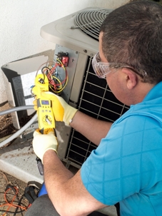 a guy performing an AC tune up