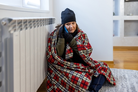 woman covered up with a blanket